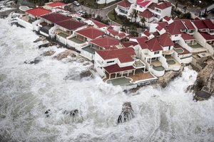 This Sept. 6, 2017 photo provided by the Dutch Defense Ministry shows a few of the homes that remained intact in the aftermath of Hurricane Irma, in St. Maarten.