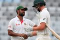 Well played: Bangladesh's Tamim Iqbal, left,  with Australia's Pat Cummins after the home side's historic win in the ...