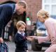 Prince George shakes the hand of Helen Haslem, head of the lower school.