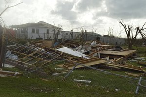 In this Thursday, Sept. 7, 2017, photo, damage is left after Hurricane Irma hit Barbuda. Hurricane Irma battered the Turks and Caicos Islands early Friday as the fearsome Category 5 storm continued a rampage through the Caribbean.