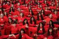 Hundreds of people put on red dresses for Melbourne's Most Wuthering Heights Day Ever in Edinburgh Gardens.