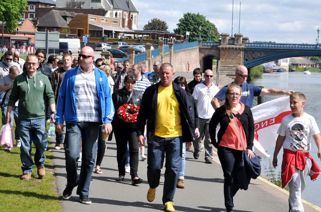 EDL members Adam Bilyk (left in green hoody), Donna Walker (carrying wreath) and Emma Laker (glasses and pink shirt)