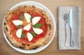 Buffalo mozzarella pizza with fresh basil and San Marzano tomatoes.