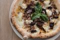 Porcinella pizza: buffalo mozzarella, parmesan, porcini, neapolitan sausage, chilli and basil. 