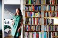 Shelley with Jessie in her light-filled apartment. Shelley made the bookshelf herself using concrete breeze blocks and ...