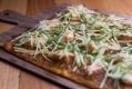 Spicy salmon tarte flambée with apple and mint.