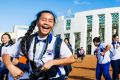 Year 5 and 6 students from from St Mel's Catholic school in Sydney outside Parliament while on an excursion.