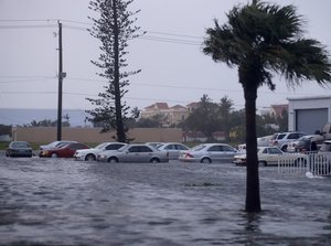 Vehicles are surrounded by water after Hurricane Irma passed through Naples, Fla., Sunday, Sept. 10, 2017.