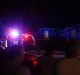 Onlookers watch police at the shooting at a home in Plano on Sunday night.