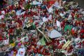 Flowers, messages and candles form a memorial tribute to the victims on Barcelona's historic Las Ramblas promenade.