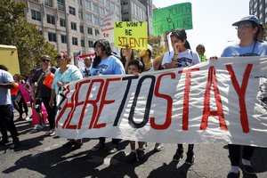 Cielo Mendez, 17, of Plainfield, N.J., who is a DACA recipient, second from left with banner, marches next to Gabriel Henao, 7, and Kimberly Armas, 15, of Elizabeth, N.J., as they march in support of the Deferred Action for Childhood Arrivals program, known as DACA, outside of Immigration and Customs Enforcement (ICE), in Washington, Tuesday, Sept. 5, 2017.