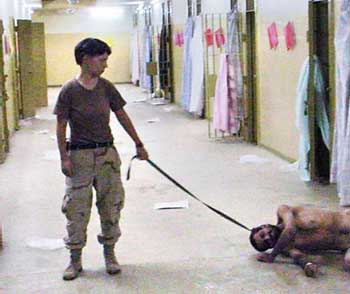 Lynndie England dragging a prisoner nicknamed Gus on October 24, 2003.