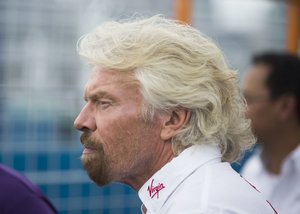 Virgin Group founder Richard Branson approaches the winner's circle