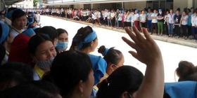 Various striking workers gather around a central courtyard.