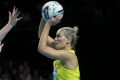 Australia's Courtney Bruce looks for a pass over New Zealand's Ta Paea Selby-Rickit in the 2016 Fast 5 Netball World Series.