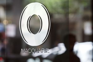 Macquarie shares rose after it said first-half profits would be up in annual terms.