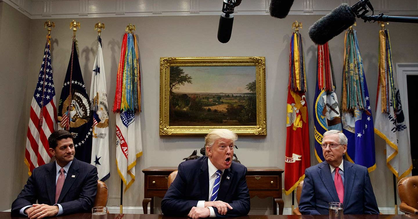 House Speaker Paul Ryan, left, and Senate Majority Leader Mitch McConnell, right, listen as Donald Trump speaks during a meeting on tax reform in the White House on September 5, 2017.