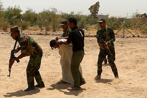 IN THIS TUESDAY, 18, JULY, 2017 PHOTO, Shiite Volunteers fighters of the Imam Ali Brigade, an armed faction with the Iraqi Popular Mobilization Forces, train in their camp in Najaf, 100 miles (160 kilometers) south of Baghdad, Iraq.