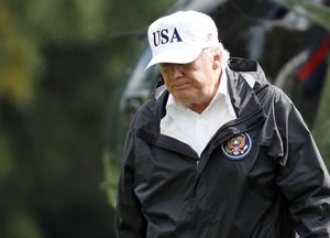 President Donald Trump walks away from Marine One as he arrives at the White House, Thursday, Sept. 14, 2017, in Washington. Trump is returning from Florida after viewing damage from Hurricane Irma. (AP Photo/Alex Brandon)