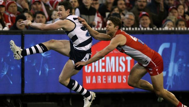 Class: Patrick Dangerfield kicks for goal.