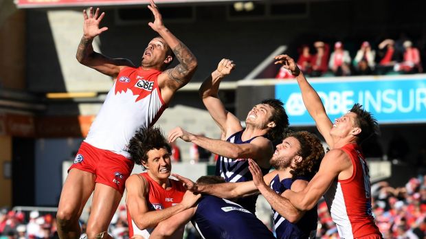 Buddy Franklin leaps high for a mark.