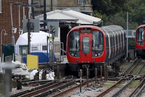 A police forensic tent stands setup on the platform next to the train on which a homemade bomb exploded at Parsons Green subway station in London, Friday, Sept. 15, 2017.