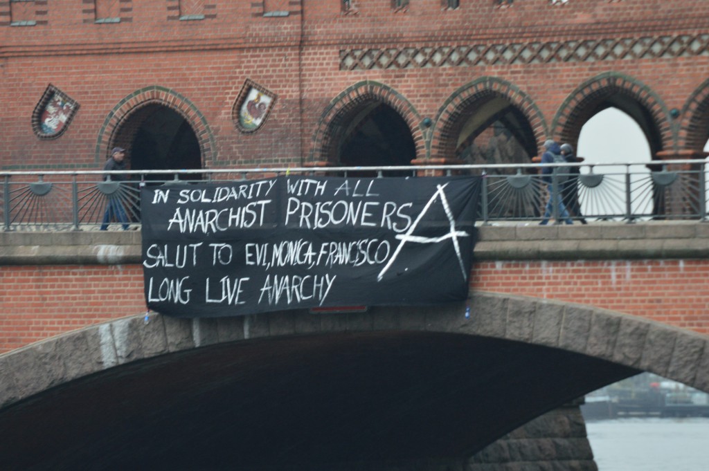 Germany: Banner drop in solidarity with Evi Statiri, Monica Caballero and Francisco Solar