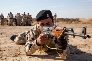 An Iraqi security forces soldier practices a prone shooting position at Besmaya Range Complex, Iraq, Feb. 1, 2017.