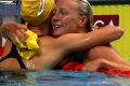 Sarah Sjostrom of Sweden is congratulated by Emma McKeon.