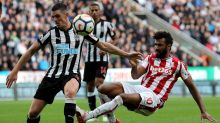 Stoke City's Eric Maxim Choupo-Moting, right, clashes with Newcastle United's Ciaran Clark during their English Premier ...