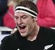 Black-out: Brodie Retallick celebrates scoring a try at QBE Stadium in Auckland.