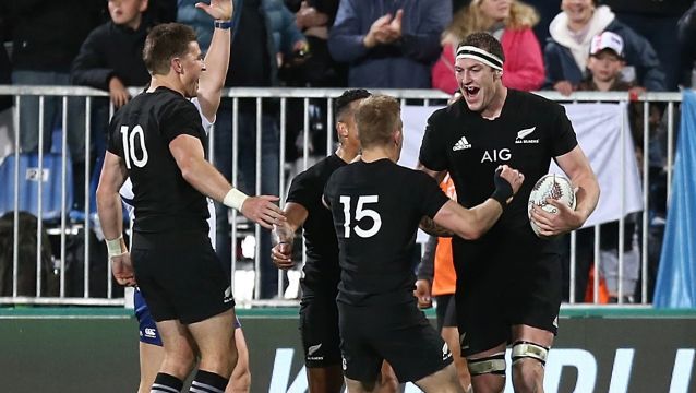 Black-out: Brodie Retallick celebrates scoring a try at QBE Stadium in Auckland.