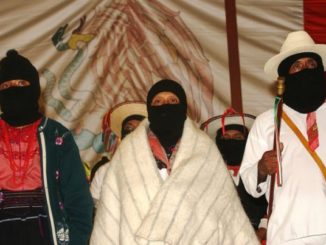 Zapatistas at anniversary celebration – Photo: Janet Schwartz