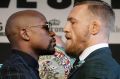 Face-off: Floyd Mayweather, left, and Conor McGregor at a news conference in Las Vegas on Wednesday.