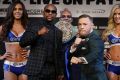 Ready to rumble: Floyd Mayweather jnr and Conor McGregor with the "Money Belt" in the background.