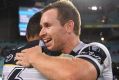 Michael Morgan and Te Maire Martin celebrate after the Cowboys' win.