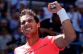 World No.1 Rafael Nadal celebrates after beating Alexandr Dolgopolov, of Ukraine.