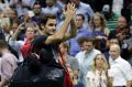 Captivating even when he doesn't win: Roger Federer leaves the court after losing to Juan Martin del Potro in the US Open.