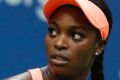 Sloane Stephens, of the United States, reacts after scoring a point against Madison Keys, of the United States, during ...