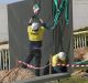 The security fence is installed across the lawns of Parliament House in Canberra.