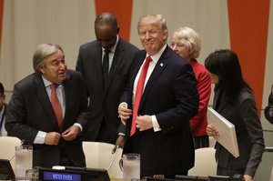 United States President Donald Trump, center, gets up to leave after making a quick statement at a meeting during the 72st session of the United Nations General Assembly at U.N. headquarters, Monday, Sept. 18, 2017. (AP Photo/Seth Wenig)