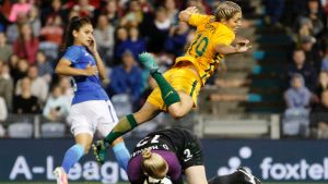 Leap of faith: Katrina Gorry dives over Brazil goalkeeper Daniele Neuhaus  during Tuesday night’s international in ...