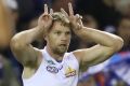 Ears cheers: Bulldog Jake Stringer celebrates the first AFL Good Friday goal.