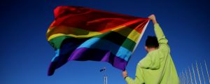 Marriage equality advocate Russell Nankervis poses with the rainbow flag during a 'Sea of Hearts' event in support of ...