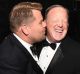 James Corden has sort of apologised for his controversial kiss with Sean Spicer at Monday's Emmy Awards.