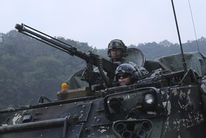 U.S. Army soldiers from the 2nd Infantry Division's the 2nd Armored Brigade Combat Team ride an armored vehicle during a joint military exercise between the U.S. and South Korea at the Rodriquez Multi-Purpose Range Complex in Pocheon, South Korea, Tuesday, Sept. 19, 2017.