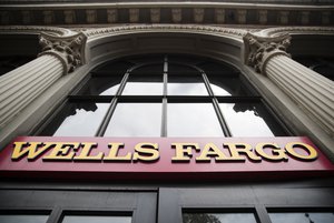 Shown is a sign at a Wells Fargo bank location in Philadelphia, Friday, Aug. 11, 2017.