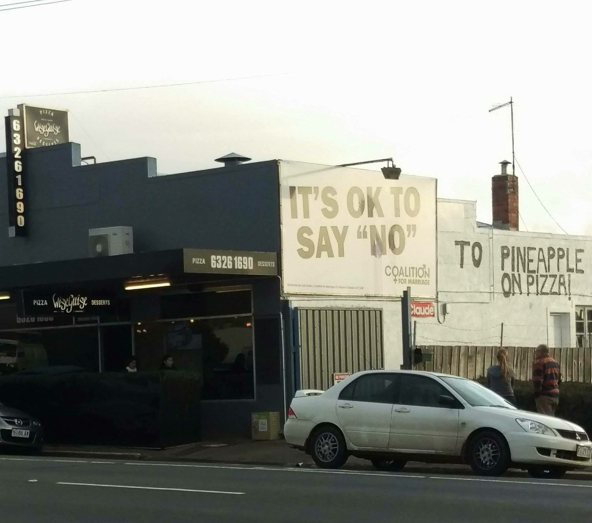 Pizza shop undermines anti-gay marriage billboard by adding pineapple