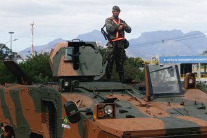 Rio de Janeiro - Brazilian soldier (military) stand atop a tank, tightens security along  the Transolimpica highway, Brazil