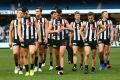 The defeated Magpies walk off the ground but coach Nathan Buckley still hopes for finals.